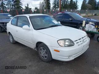 2004 Hyundai Accent GL with VIN KMHCG35C74U303431, listed as a IAAI auction lot 41725717 with 211,893 mi miles. Bid and sale history available at carsss.com. Image 1.