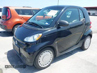 2015 Smart fortwo Passion z VIN WMEEJ3BA9FK805052, wystawiony jako IAAI lot #42522066 z przebiegiem 101 506 mil mil oraz . Historia ofert i sprzedaży dostępna na DreamBid. Obrazek 2.