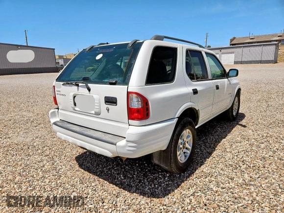 2004 Isuzu Rodeo S z VIN 4S2CK58W544313903, wystawiony jako Copart lot #57535585 z przebiegiem 121 385 mil mil oraz Tytuł czysty. Historia ofert i sprzedaży dostępna na DreamBid. Obrazek 4.