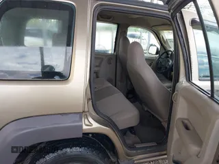 2003 Jeep Liberty Sport z VIN 1J4GK48K63W602709, wystawiony jako IAAI lot #42176496 z przebiegiem 151 397 mil mil oraz . Historia ofert i sprzedaży dostępna na DreamBid. Obrazek 8.