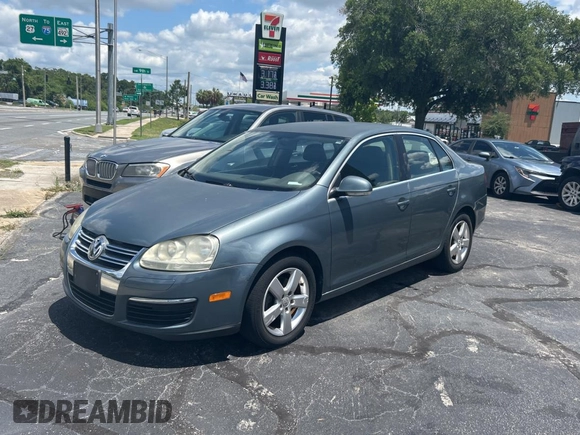 2006 Volkswagen Jetta z VIN 3VWRG81K46M724245, wystawiony jako Copart lot #57293785 z przebiegiem 212 639 mil mil oraz Czysty tytuł • Clean title. Historia ofert i sprzedaży dostępna na DreamBid. Obrazek 2.