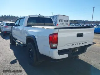 2017 Toyota Tacoma SR5 with VIN 3TMDZ5BN3HM023813, listed as a IAAI auction lot 41522828 with 128,533 mi miles. Bid and sale history available at carsss.com. Image 3.