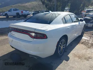 2019 Dodge Charger SXT with VIN 2C3CDXJGXKH533322, listed as a IAAI auction lot 41808838 with 95,877 mi miles and . Bid and sale history available at DreamBid. Image 4.
