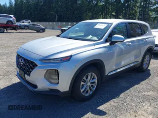 2019 Hyundai Santa Fe SE with VIN 5NMS2CAD9KH122140, listed as a IAAI auction lot 42616171 with 50,794 mi miles and . Bid and sale history available at DreamBid. Image 2.