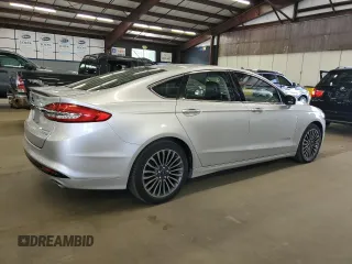 2017 Ford Fusion Hybrid Titanium z VIN 3FA6P0RU1HR300370, wystawiony jako Copart lot #65206605 z przebiegiem 150 424 mil mil oraz Czysty tytuł • Clean title. Historia ofert i sprzedaży dostępna na DreamBid. Obrazek 3.