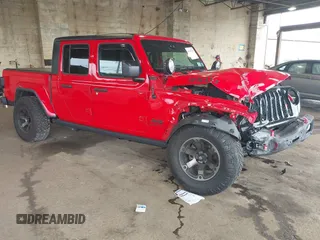 2021 Jeep Gladiator Willys z VIN 1C6HJTAG7ML602130, wystawiony jako IAAI lot #42161745 z przebiegiem 49 576 mil mil oraz . Historia ofert i sprzedaży dostępna na DreamBid. Obrazek 1.