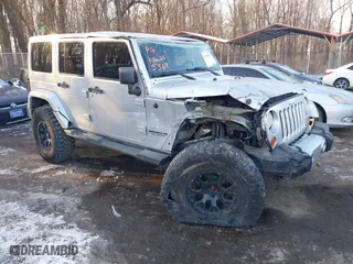 2012 Jeep Wrangler Unlimited Sahara with VIN 1C4BJWEG7CL105569, listed as a IAAI auction lot 41395563 with 157,073 mi miles. Bid and sale history available at carsss.com. Image 1.