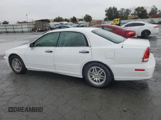 2003 Mitsubishi Diamante LS z VIN 6MMAP67P43T002798, wystawiony jako Copart lot #80368974 z przebiegiem 134 099 mil mil oraz Tytuł czysty. Historia ofert i sprzedaży dostępna na DreamBid. Obrazek 2.