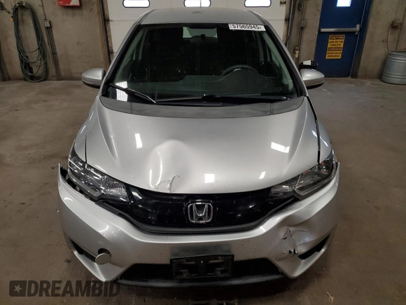 2015 Honda Fit LX с VIN 3HGGK5H56FM720996, выставлен на аукционе Copart как лот 57565945 с пробегом 90 222 миль миль и Списание • Salvage title. История ставок и продаж доступна на DreamBid. Изображение 5.