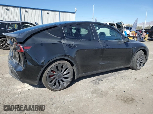 2023 Tesla Model Y Performance with VIN 7SAYGDEF7PF924355, listed as a Copart auction lot 47877055 with 64,663 mi miles and Salvage Title. Bid and sale history available at DreamBid. Image 3.