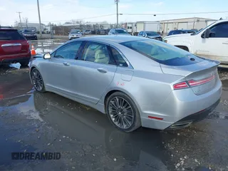2014 Lincoln MKZ z VIN 3LN6L2J95ER830342, wystawiony jako IAAI lot #41876269 z przebiegiem 137 089 mil mil oraz . Historia ofert i sprzedaży dostępna na DreamBid. Obrazek 3.