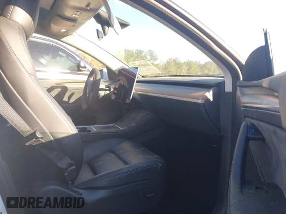 2023 Tesla Model Y Long Range with VIN 7SAYGAEE3PF753657, listed as a IAAI auction lot 41668917 with 33,301 mi miles and . Bid and sale history available at DreamBid. Image 5.