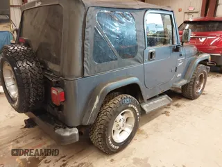 2001 Jeep Wrangler Sport with VIN 1J4FA49SX1P375657, listed as a IAAI auction lot 41943331 with 170,640 mi miles. Bid and sale history available at carsss.com. Image 4.