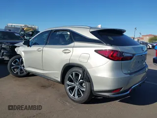 2021 Lexus RX 450h with VIN 2T2HGMDA0MC067228, listed as a IAAI auction lot 41818836 with 28,850 mi miles and . Bid and sale history available at DreamBid. Image 3.