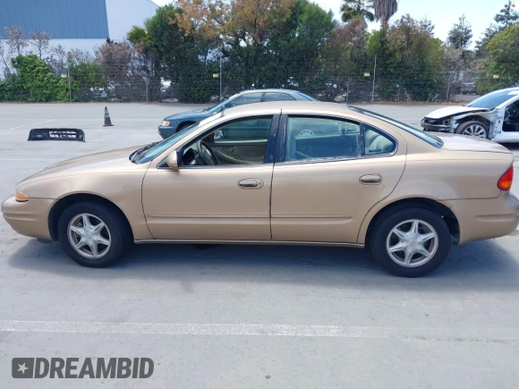1999 Oldsmobile Alero GL z VIN 1G3NL52T1XC384073, wystawiony jako IAAI lot #42359330 z przebiegiem 177 869 mil mil oraz . Historia ofert i sprzedaży dostępna na DreamBid. Obrazek 14.