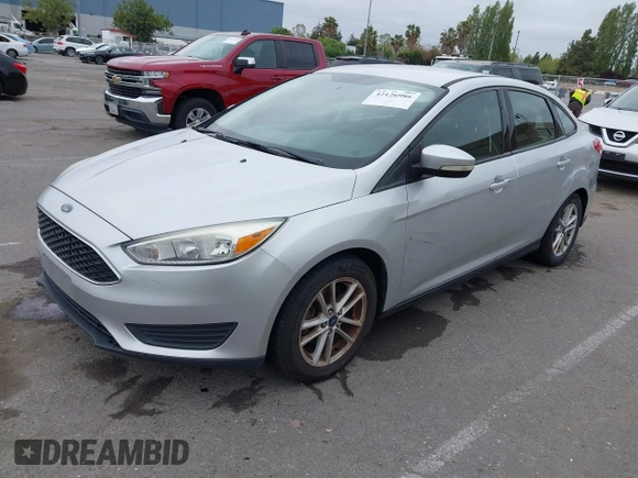 2015 Ford Focus SE z VIN 1FADP3F21FL218369, wystawiony jako IAAI lot #42126986 z przebiegiem 99 844 mil mil oraz . Historia ofert i sprzedaży dostępna na DreamBid. Obrazek 2.