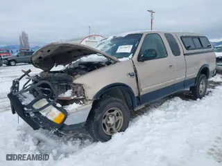 1998 Ford F-150 Standard with VIN 1FTZX18W5WKB97701, listed as a IAAI auction lot 41254873 with 291,523 mi miles. Bid and sale history available at carsss.com. Image 2.