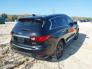 2020 Infiniti QX60 Pure with VIN 5N1DL0MN4LC539573, listed as a IAAI auction lot 42010032 with 104,507 mi miles and . Bid and sale history available at DreamBid. Image 4.