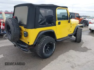 2000 Jeep Wrangler SE with VIN 1J4FA29P2YP797156, listed as a IAAI auction lot 41517183 with 114,236 mi miles. Bid and sale history available at carsss.com. Image 4.