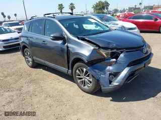 2018 Toyota RAV4 Hybrid LE Plus with VIN JTMRJREV4JD227473, listed as a IAAI auction lot 41987080 with 112,067 mi miles. Bid and sale history available at carsss.com. Image 1.