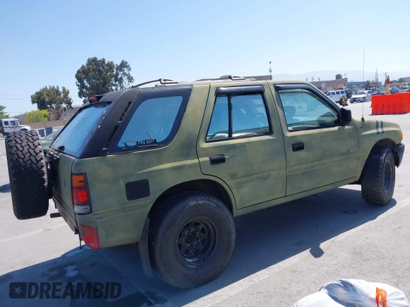 1995 Isuzu Rodeo z VIN 4S2CK58E5S4379419, wystawiony jako IAAI lot #42094055 z przebiegiem 196 175 mil mil oraz . Historia ofert i sprzedaży dostępna na DreamBid. Obrazek 4.