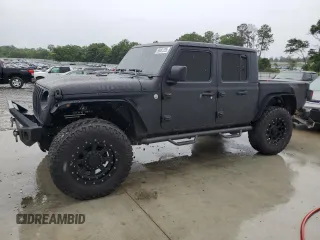 2020 Jeep Gladiator Sport S with VIN 1C6HJTAG2LL108014, listed as a Copart auction lot 58481225 with 123,579 mi miles and Salvage title. Bid and sale history available at DreamBid. Image 1.