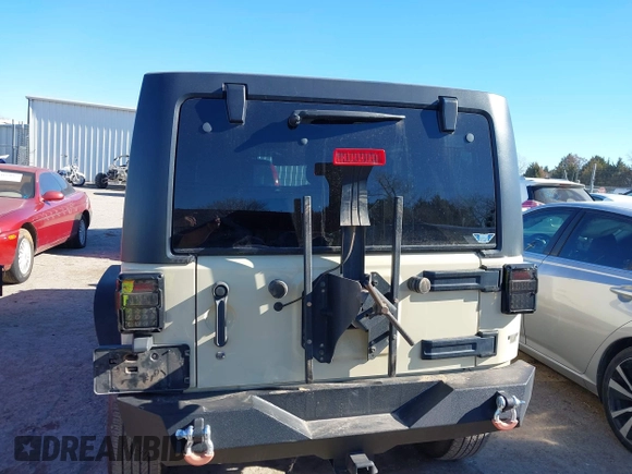 2012 Jeep Wrangler Unlimited Sport z VIN 1C4BJWDG8CL102486, wystawiony jako IAAI lot #41386649 z przebiegiem 156 993 mil mil oraz . Historia ofert i sprzedaży dostępna na DreamBid. Obrazek 16.
