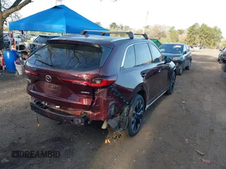 2024 Mazda CX-90 S Premium z VIN JM3KKDHC2R1101502, wystawiony jako IAAI lot #42114075 z przebiegiem 16 288 mil mil oraz . Historia ofert i sprzedaży dostępna na DreamBid. Obrazek 4.