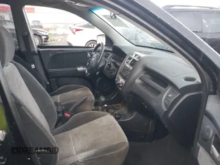 2005 Kia Sportage LX with VIN KNDJF723557054234, listed as a IAAI auction lot 40652851 with 220,215 mi miles and . Bid and sale history available at carsss.com. Image 5.