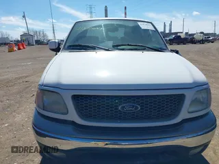 2003 Ford F-150 XLT with VIN 1FTRW07663KD57580, listed as a IAAI auction lot 41870643 with 256,497 mi miles. Bid and sale history available at carsss.com. Image 12.