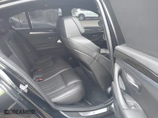 2013 BMW M5 with VIN WBSFV9C51DD095750, listed as a IAAI auction lot 40907304 with 93,014 mi miles. Bid and sale history available at carsss.com. Image 8.