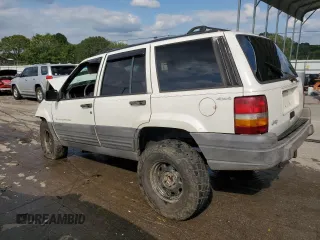1996 Jeep Grand Cherokee Laredo with VIN 1J4GZ58S9TC277492, listed as a Copart auction lot 66732404 with Not provided miles and Salvage title. Bid and sale history available at DreamBid. Image 2.