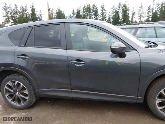 2016 Mazda CX-5 Grand Touring with VIN JM3KE4DY0G0652829, listed as a IAAI auction lot 41786042 with NaN miles. Bid and sale history available at carsss.com. Image 14.