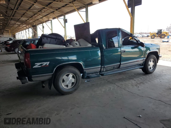 1997 GMC Sierra 1500 z VIN 2GTEK19RXV1501674, wystawiony jako Copart lot #59061595 z przebiegiem 138 998 mil mil oraz Szkoda całkowita • Salvage title. Historia ofert i sprzedaży dostępna na DreamBid. Obrazek 3.