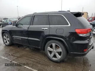 2015 Jeep Grand Cherokee Overland with VIN 1C4RJFCG7FC925995, listed as a Copart auction lot 85421214 with 142,266 mi miles and Salvage Title. Bid and sale history available at carsss.com. Image 2.