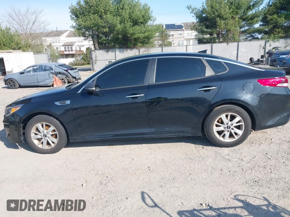 2016 Kia Optima LX with VIN 5XXGT4L36GG105637, listed as a IAAI auction lot 42013800 with 111,836 mi miles. Bid and sale history available at carsss.com. Image 13.