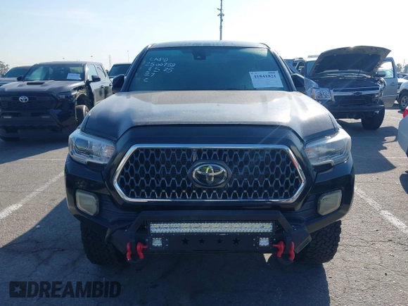 2019 Toyota Tacoma SR z VIN 5TFCZ5AN9KX199814, wystawiony jako IAAI lot #41841821 z przebiegiem 69 276 mil mil oraz . Historia ofert i sprzedaży dostępna na DreamBid. Obrazek 12.