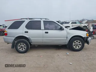 1999 Isuzu Rodeo S with VIN 4S2CK58W4X4358898, listed as a IAAI auction lot 41360738 with 184,948 mi miles and . Bid and sale history available at carsss.com. Image 13.