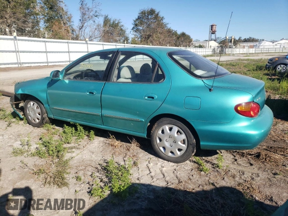 2000 Hyundai Elantra GLS z VIN KMHJF35FXYU998689, wystawiony jako Copart lot #76181814 z przebiegiem 154 743 mil mil oraz Szkoda całkowita • Salvage title. Historia ofert i sprzedaży dostępna na DreamBid. Obrazek 2.