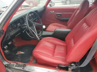 1981 Pontiac Firebird z VIN 1G2AS87A4BN117926, wystawiony jako Copart lot #63220014 z przebiegiem 54 759 mil mil oraz Tytuł czysty. Historia ofert i sprzedaży dostępna na DreamBid. Obrazek 7.
