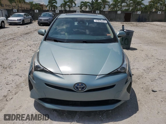 2017 Toyota Prius Two z VIN JTDKARFUXH3040343, wystawiony jako Copart lot #57870425 z przebiegiem 59 711 mil mil oraz Szkoda całkowita • Salvage title. Historia ofert i sprzedaży dostępna na DreamBid. Obrazek 5.