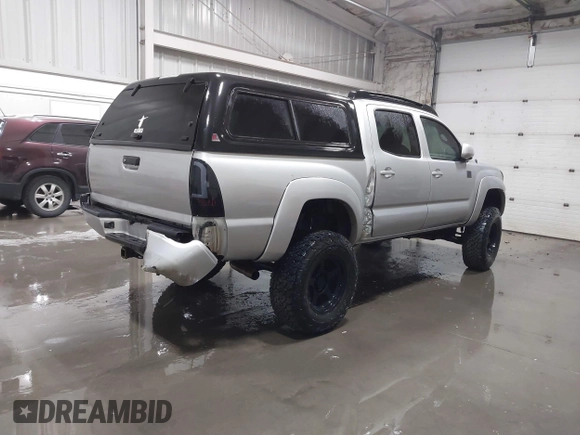 2011 Toyota Tacoma with VIN 3TMLU4EN9BM070836, listed as a IAAI auction lot 41668595 with 89,879 mi miles and . Bid and sale history available at DreamBid. Image 4.