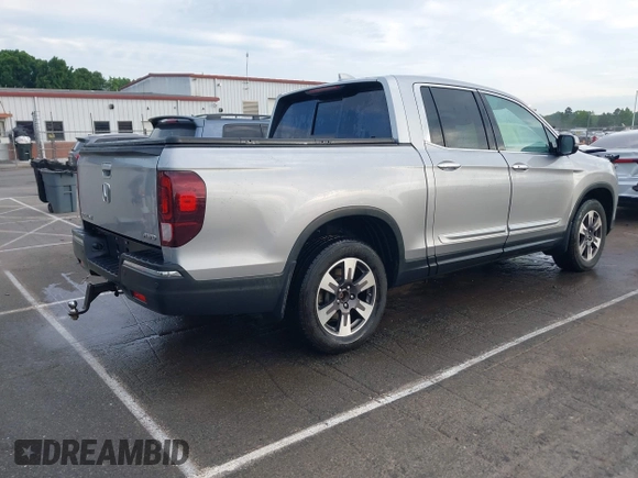 2019 Honda Ridgeline RTL-E with VIN 5FPYK3F72KB026100, listed as a IAAI auction lot 42205910 with 78,359 mi miles and . Bid and sale history available at DreamBid. Image 4.