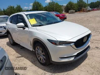 2019 Mazda CX-5 Grand Touring with VIN JM3KFBDM9K1675852, listed as a IAAI auction lot 42545576 with 105,260 mi miles and . Bid and sale history available at DreamBid. Image 1.