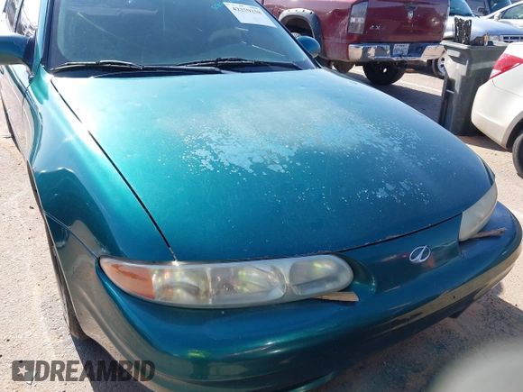 1999 Oldsmobile Alero GL z VIN 1G3NL52T0XC354966, wystawiony jako IAAI lot #42259258 z przebiegiem Nie podano mil oraz . Historia ofert i sprzedaży dostępna na DreamBid. Obrazek 12.
