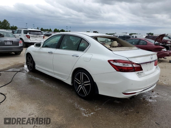 2017 Honda Accord Touring with VIN 1HGCR3F91HA009968, listed as a Copart auction lot 55858414 with 133,083 mi miles and Salvage title. Bid and sale history available at DreamBid. Image 2.