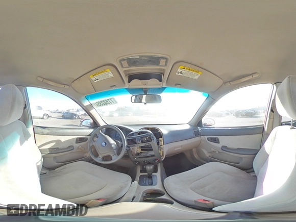 2005 Kia Spectra LX with VIN KNAFE122855108907, listed as a Copart auction lot 77502354 with Not Provided miles and Salvage Title. Bid and sale history available at carsss.com. Image 12.