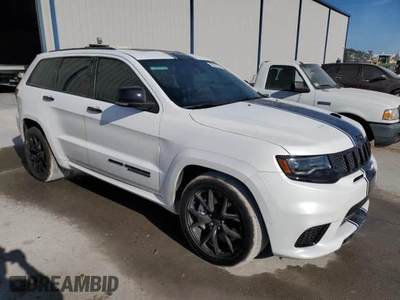2019 Jeep Grand Cherokee Trackhawk with VIN 1C4RJFN92KC564748, listed as a Copart auction lot 82677504 with 48,528 mi miles and Salvage title. Bid and sale history available at DreamBid. Image 4.