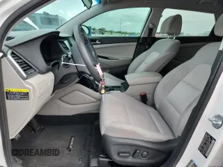 2018 Hyundai Tucson SEL Plus z VIN KM8J33A41JU670631, wystawiony jako Copart lot #59887105 z przebiegiem 133 012 mil mil oraz Szkoda całkowita • Salvage title. Historia ofert i sprzedaży dostępna na DreamBid. Obrazek 7.