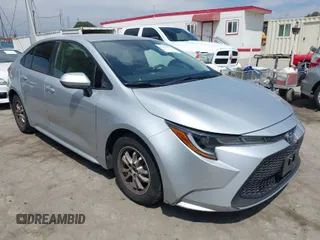 2022 Toyota Corolla Hybrid LE with VIN JTDEAMDE6NJ056705, listed as a IAAI auction lot 42032119 with 197,030 mi miles. Bid and sale history available at carsss.com. Image 1.